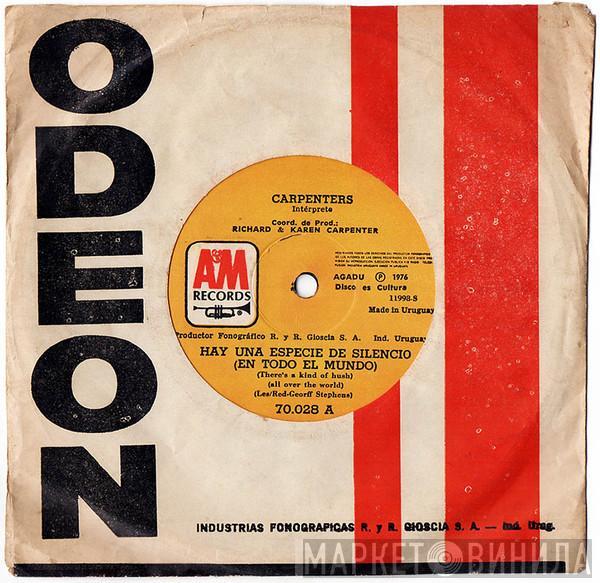  Carpenters  - Hay Una Especie De Silencio (En Todo El Mundo) = A Kind Of Hush (All Over The World)  / Estoy Atrapado Entre Un Adiós Y Un Te Quiero = I'm Caught Between Goodbye And I Love You