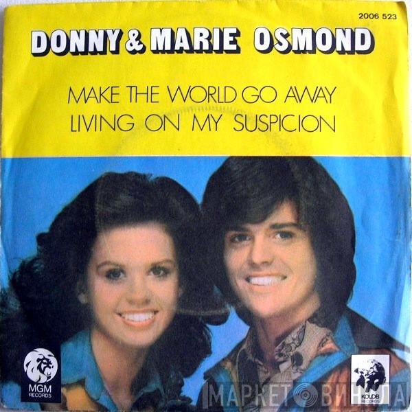  Donny & Marie Osmond  - Make The World Go Away / Living On My Suspicion