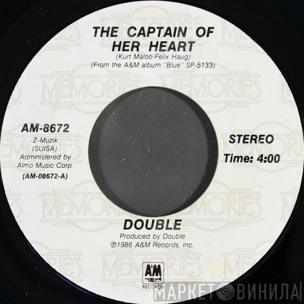 Double - The Captain Of Her Heart / Woman Of The World