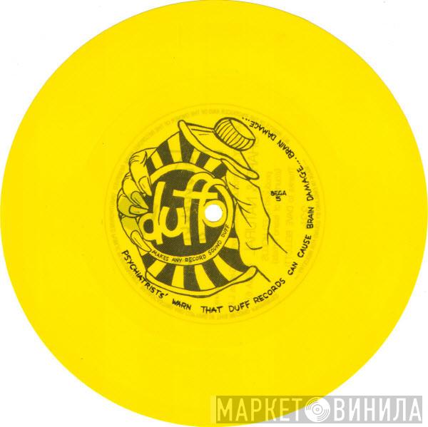 Duffo, Johnny G - Psychiatrists' Warn That Duff Records Can Cause Brain Damage ... Brain Damage ... / Johnny G. Introduces Slices From His Genius L.P. Sharp & Natural