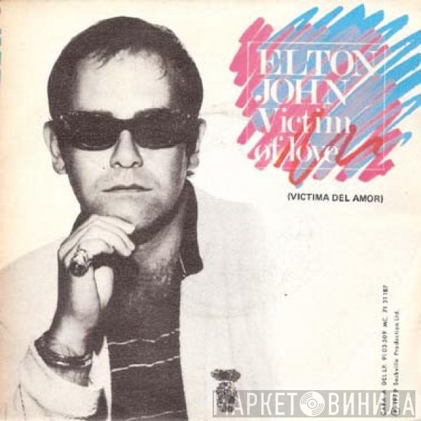  Elton John  - Victim Of Love = Victima Del Amor