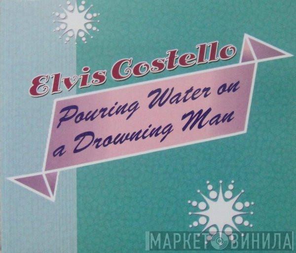  Elvis Costello  - Pouring Water On A Drowning Man