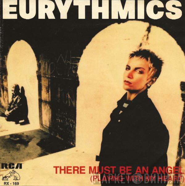  Eurythmics  - There Must Be An Angel (Playing With My Heart) = Debe Haber Un Angel (Jugando Con Mi Corazón)
