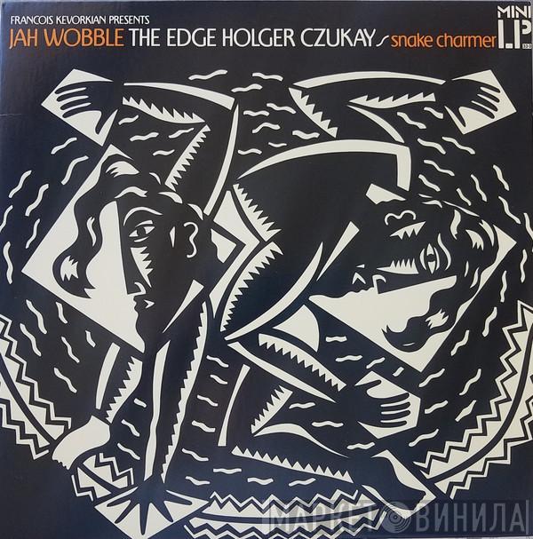- Jah Wobble - The Edge  Holger Czukay  - Snake Charmer