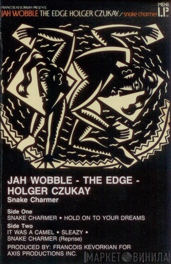 - Jah Wobble - The Edge  Holger Czukay  - Snake Charmer