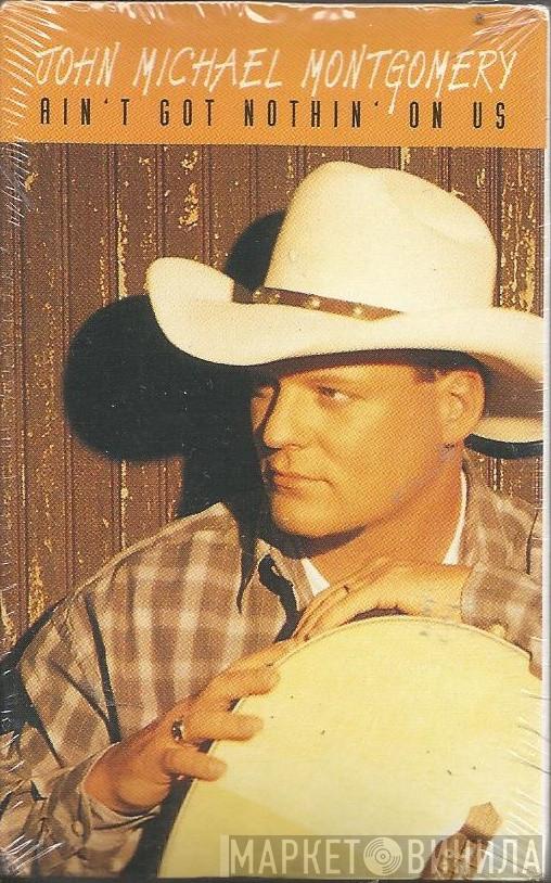  John Michael Montgomery  - Ain't Got Nothin' On Us