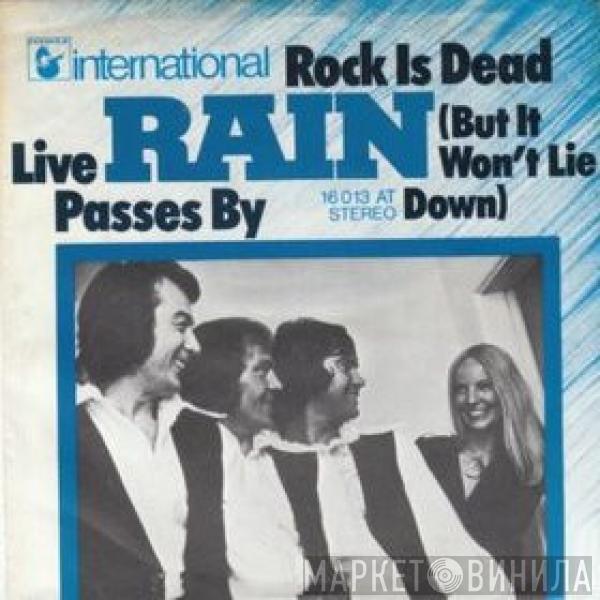 Rain  - Rock Is Dead (But It Won't Lie Down) / Live Passes By