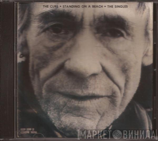  The Cure  - Standing On A Beach • The Singles