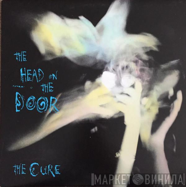  The Cure  - The Head On The Door